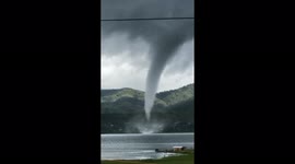 Huge waterspout whirls around near resident's house on Indonesian lake