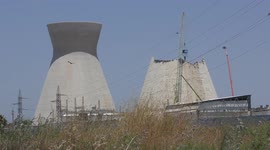 A huge tool is used to demolish water cooling tower of Bazan oil refinery (Lebenia bottle) after its collapse. The demise of pollution in Haifa bay, Israel.