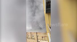 Terrifying moment black smoke surrounds a man's apartment - just metres from the Elephant and Castle fire