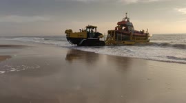 Royal Dutch rescue brigade lifting rescue boat from the sea