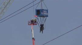 A huge tool is used to demolish water cooling tower of Bazan oil refinery