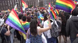 Pride Parade in Mexico City, camera from above, people cheering in the Zocalo
