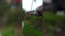 Locals surround crashed diesel tanker to collect leaking fuel in central India