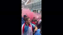 Lively England fans light flares, throw beer over each other outside Wembley