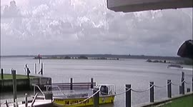 Pontoon Boat drives through channel marker in Saint Augustine Florida.