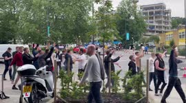 Jubilant England fans celebrate victory over Germany with flags and songs