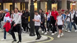 A few hundred England fans celebrate Germany win at Eros Statue in Piccadilly Circus