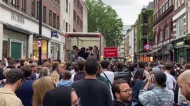 England supporters climb into a parked delivery truck after the Euro 2020 win over Germany, London, UK