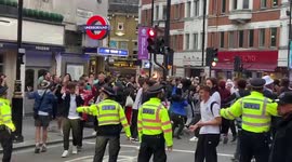 Police disperse fervent English football fans following 2-0 win over Germany