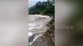 Chinese boy rescued after being washed away by rapid river
