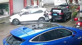 Car narrowly misses Chinese woman after motorist presses accelerator by mistake