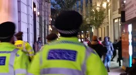 Large number of celebrating England fans chased by police, dancing in the streets and jumping off roofs