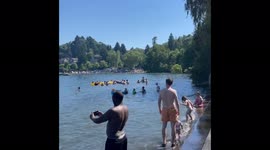 Seattle residents flock to Lake Washington as historic heatwave begins