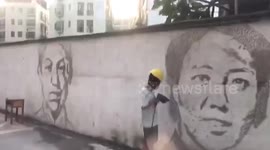 Man uses electric drill to engrave portraits of Chinese heroes into wall