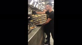 Talented waiter in Israel impressively carries 31 PLATES all at once