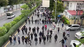 Thai protesters march through streets around government building