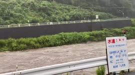 Torrential seasonal rain in Japan sparks landslides and flooding