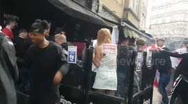 England fans storm bar in London's West End, set off smoke flare and tear down barriers