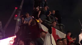 England fans celebrate on Picadilly Circus Eros statue following 4-0 win against Ukraine in the EURO 2020