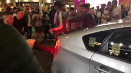 Post-match chaos in central London as violent fans kick car that then drives into them!