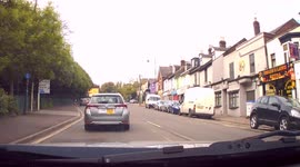 DASHCAM - Cyclist rides through red light into oncoming traffic!