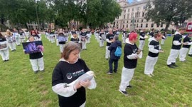 Animal rights activists stage a demonstration holding frozen animals outside British parliament