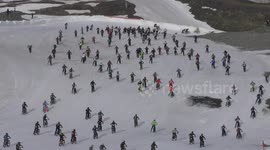 Cyclists crash as they speed down snowy mountain face during this year’s Mountain of Hell race