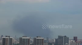Smoke rises across Bangkok after factory explosion that killed one person and injured 60 others