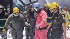 Injured firemen emerge from factory explosion that killed one person and injured 60 others in Thailand