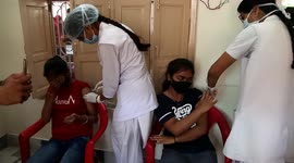 Indian Girl reacts while receiving a dose of COVID-19 Vaccine in Rajasthan