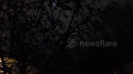On the Night of the January Wolf Moon a Spooky Full Moon and Clouds in My Backyard at Night
