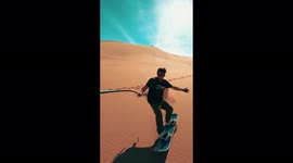 Sand dune surfer films cool selfie video in Chile