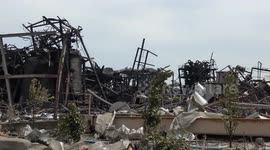 Thailand factory explosion aftermath leaves damaged buildings and cars