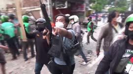 Hundreds of motorcycle taxi riders attack offices of debt collector in central Jakarta