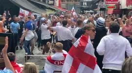 Lively England fans sing, drink and dance outside pub in London’s Leicester Square