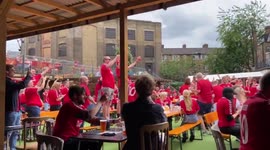 Danish fans stand on tables, singing anthem ahead of clash against England