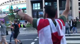 Fans celebrate outside Wembley after England draw level with Denmark own-goal