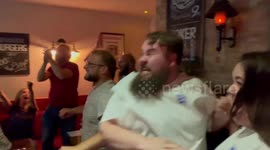 Pub goers in St Albans, England celebrate as Harry Kane scores winning goal