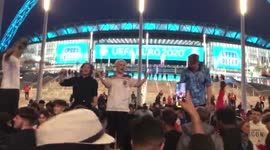 England fans outside Wembley Stadium celebrate winning goal by Harry Kane