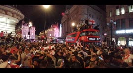 England fans party on top of double-decker bus in London to celebrate win over Denmark