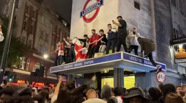 Chaotic scenes in London's Leicester Square as fans climb on station and police move in