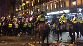 English fans throw bottles at police on horses after Euro 2020 win against Denmark