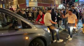 England football fans celebrate in central London after England’s 2-1 win over Denmark in the Euro 2020 semi-final