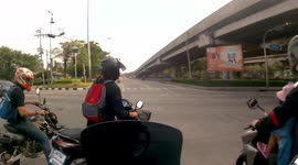 Motorcycle rider nudged by car when he ran through red light