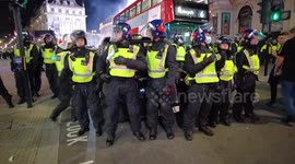 Riot police seal off Piccadilly Circus, attempt to move thousands of football fans following England's Euro 2020 win over Denmark