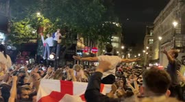 England fans party all night but clash with riot police in london after beating Denmark 2-1 in the Euro2020 semifinal