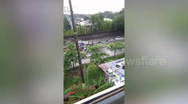 Motorcycle riders left stranded on flooded road after water reached waist-deep in the Philippines