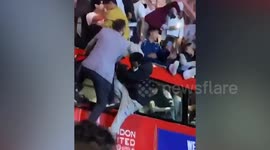 Dozens of England fans climb on bus roof during Euro 2020 celebrations