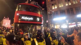 Football Fans Celebrate England Win by Climbing On Buses, Man Falls Off Onto His Back (night) London (07.07.21)