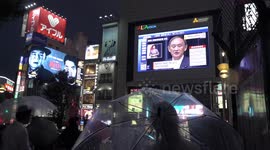 Tokyoites watch PM Suga declare FOURTH state of emergency on big-screen in Shinjuku